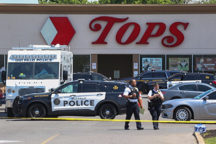 Police walk outside Tops on May 15, 2022, in Buffalo, N.Y., after a mass shooting at the supermarket left 10 Black people dead.