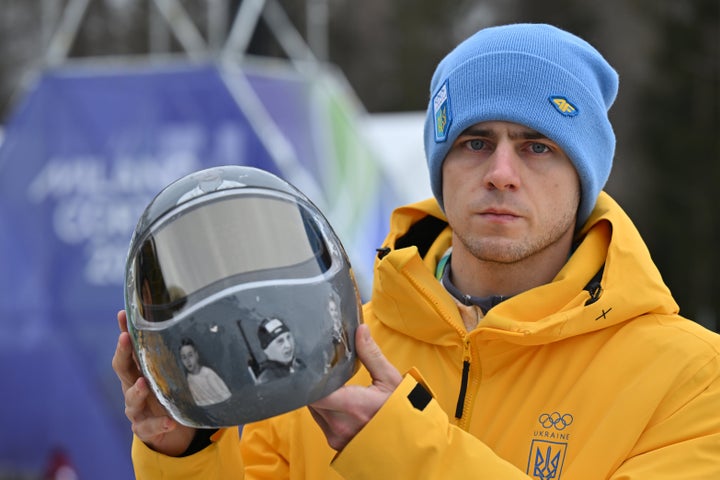 Ukraine's Vladislav Heraskevych has been banned from the Olympic skeleton competition in a dispute over his helmet with pictures of fellow athletes killed in the Russia war.