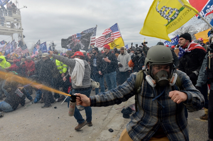 Trump supporters clash with police and security forces as people try to storm the U.S. Capitol Building in Washington, D.C., on Jan. 6, 2021. Demonstrators breached security and entered the Capitol as Congress debated the Electoral Vote Certification for the 2020 presidential election.