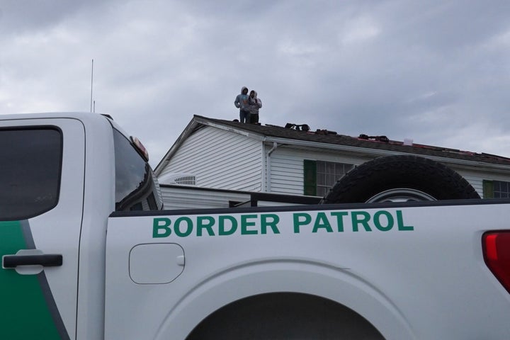 Construction workers refuse to come down from a roof after U.S. Border Patrol agents conducted a raid at a construction site on Dec. 3, 2025, in Metairie, Louisiana. This comes on the first day of the operation in Louisiana, 'Catahoula Crunch,' launched by the Department of Homeland Security as a part of the immigration enforcement surge on undocumented immigrants in the United States.