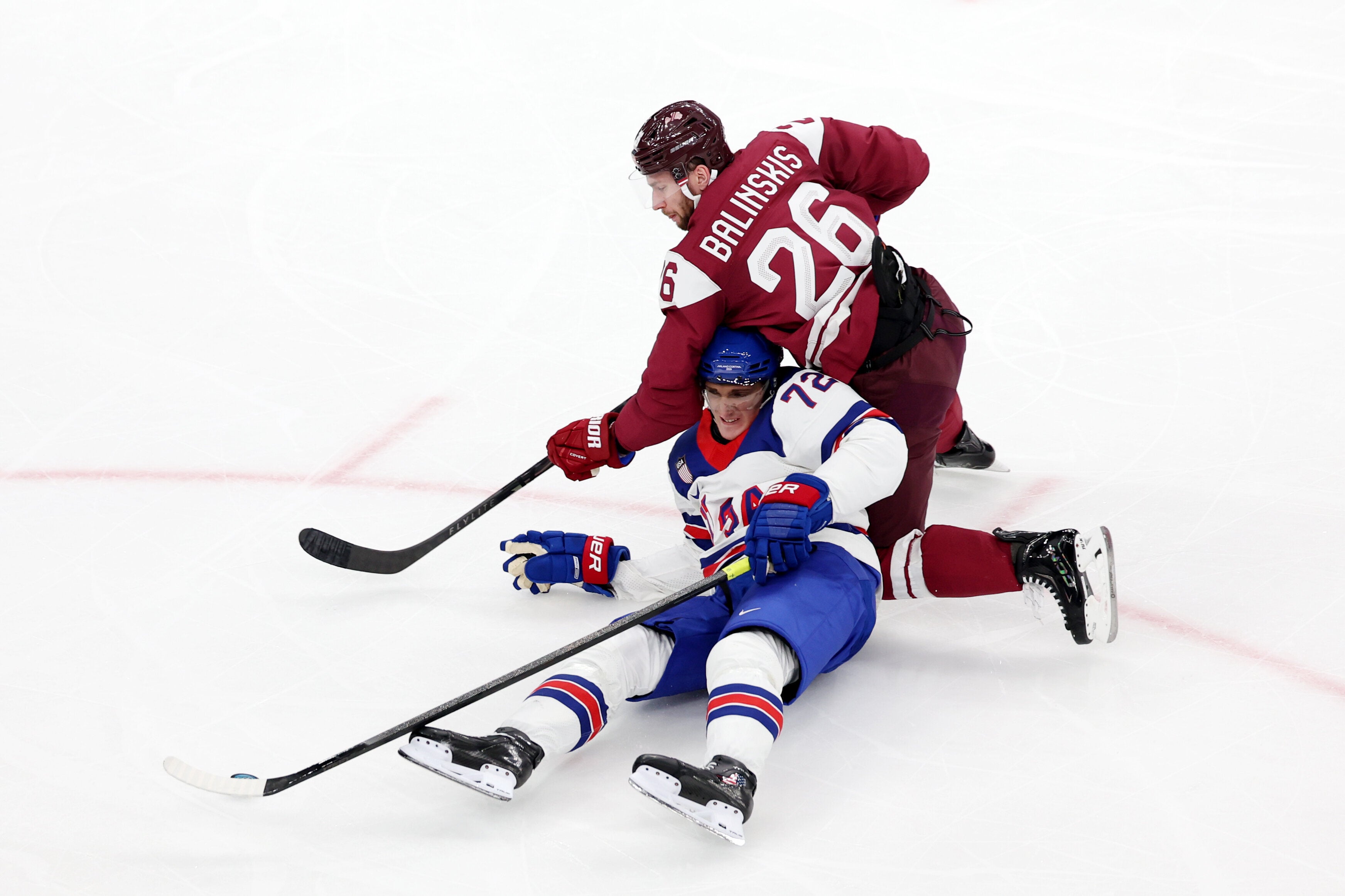 The U.S. were tied 1-1 with the underdogs going into the second period of their group stage game after the Latvians successfully challenged two of their goals, a frustrating start for the expected gold medal contenders.