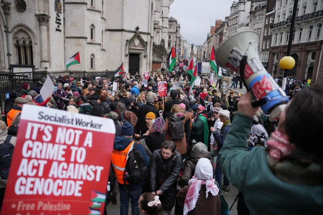 Supporters of Palestine Action stage a protest outside the Royal Court of Justice in London, Friday, Feb. 13, 2026. (AP Photo/Kin Cheung)