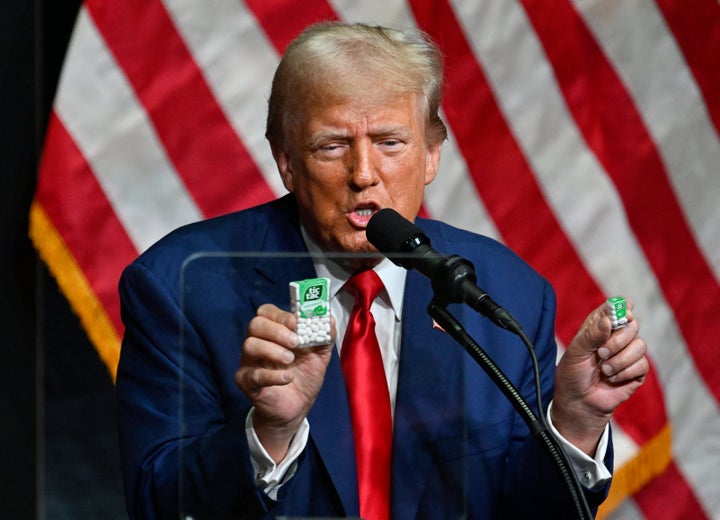Then-presidential candidate Donald Trump holding boxes of Tic-Tacs as a prop to demonstrate the concept of inflation. 