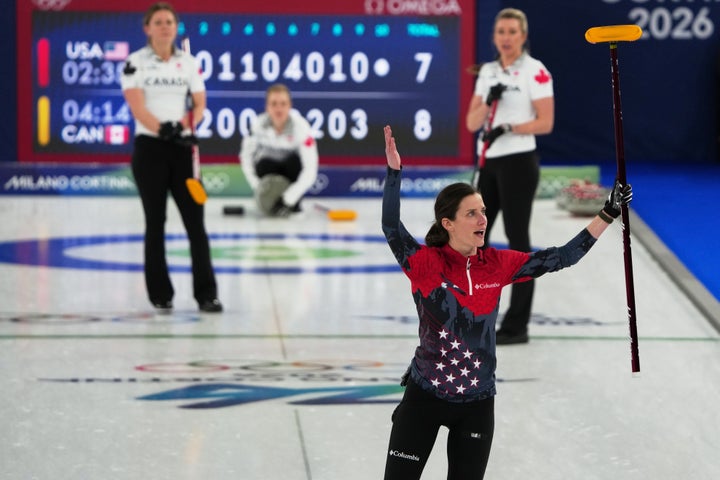 United States' Tabitha Peterson, Taylor Anderson-Heide, and Cory Thiesse react after the women's curling round robin session against Canada, at the 2026 Winter Olympics, in Cortina d'Ampezzo, Italy, Friday, Feb. 13, 2026. (AP Photo/Misper Apawu)