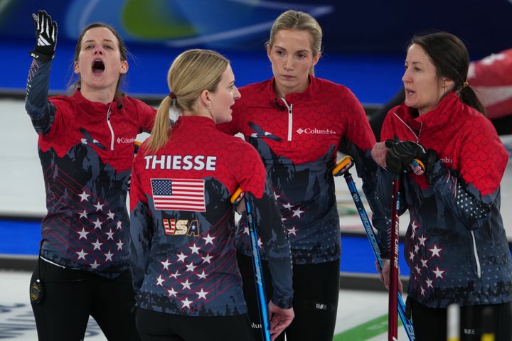 Cory Thiesse, Taylor Anderson-Heide, Tabitha Peterson and Tara Peterson of the United States in action during the women's curling round robin session against Canada at the 2026 Winter Olympics in Cortina d'Ampezzo, Italy, Friday, Feb. 13, 2026. (AP Photo/Misper Apawu)