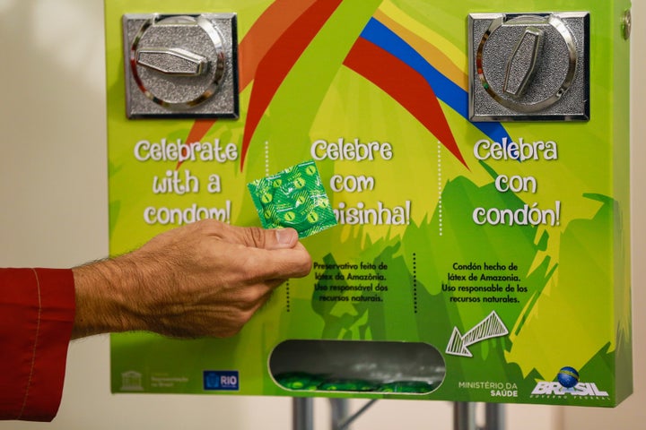 Condom dispensers, like this one at the 2016 Summer Olympics, are running dry at the Milan-Cortina Winter Olympics.