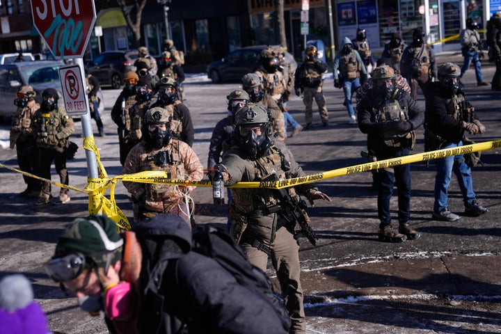 Federal immigration officers deploy pepper spray at protesters after a shooting Saturday, Jan. 24, 2026, in Minneapolis.