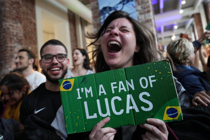 Supporters of Brazil's Lucas Pinheiro Braathen react at the Brazil House as he wins the men's giant slalom at the 2026 Winter Olympics in Milan, Italy, Saturday, Feb. 14, 2026. (AP Photo/Antonio Calanni)