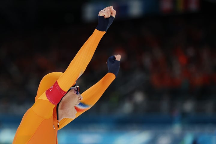 Femke Kok celebrates after breaking the Olympic record in the women's 500-meters speedskating final on Sunday.