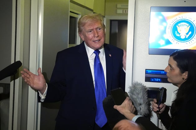 President Donald Trump speaks with reporters aboard Air Force One, Monday, Feb. 16, 2026, en route to Washington from West Palm Beach, Fla.
