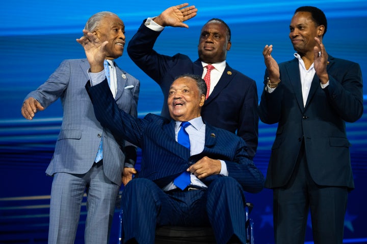 Jackson (seated) is seen with the Rev. Al Sharpton (left) and his sons Rep. Jonathan Jackson and Yusef DuBois Jackson (right) during the 2024 Democratic National Convention in Chicago.