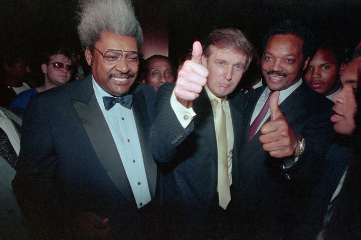 Jackson is seen with Donald Trump and boxing promoter Don King before a boxing match at Atlantic City's Trump Plaza in 1988.