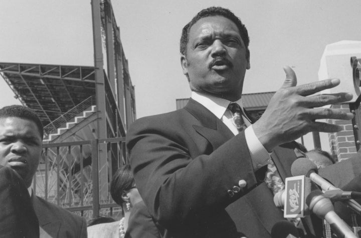 Jackson delivers a speech in front of a football stadium in 1960.