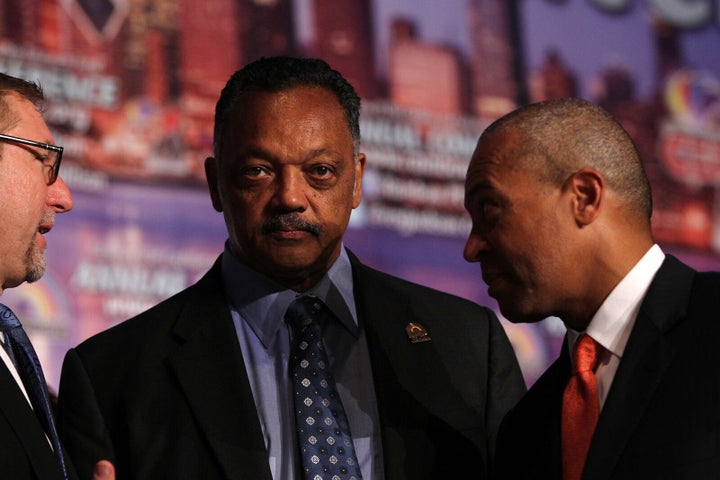 Jackson is seen with then-General Motors Chief Marketing Officer Joel Ewanick, left and then-Massachusetts Gov. Deval Patrick during Jackson's annual Operation/PUSH Coalition conference in Chicago in 2012.
