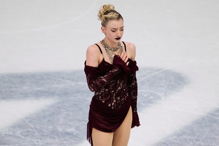 Team USA's Amber Glenn reacts after the women's short program in Milan on Tuesday. She fought back tears as she stepped off the ice and ultimately finished in 13th place with a score of 67.39.