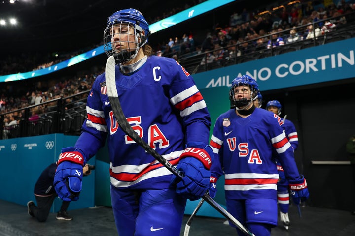 U.S. women's ice hockey captain Hilary Knight (left) leads her teammates onto the ice before a semifinal match against Sweden at Milano Santagiulia Ice Hockey Arena on Monday.