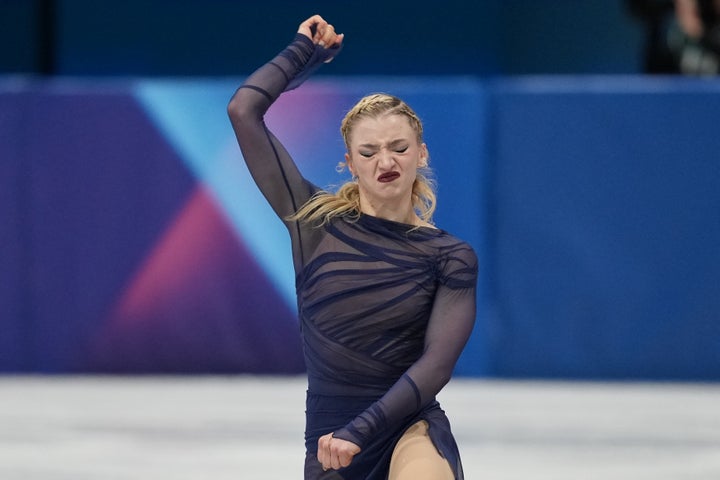 Team USA's Amber Glenn pumps her fist after her redemptive performance on the ice on Thursday.