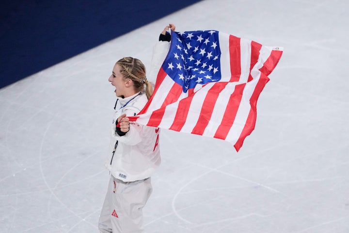 American figure skater Amber Glenn celebrates winning the gold medal after the figure skating team event.
