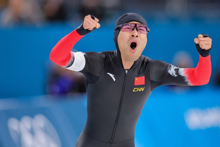 China's Ning Zhongyan celebrates winning gold after the 1,500 meter speed skating event.