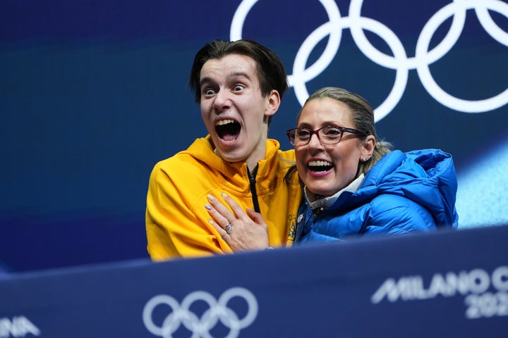 Ukraine's Kyrylo Marsak reacts to his scores after competing during the men's figure skating short program.