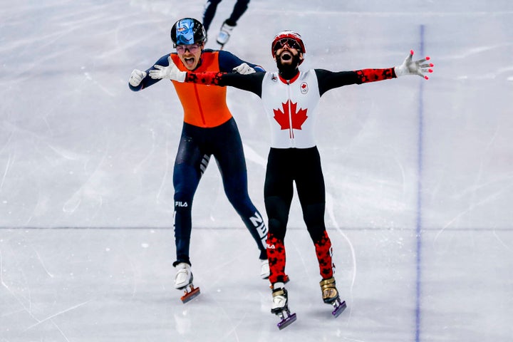 Canadian Steven Dubois celebrates his 500 meter short track speed skating.