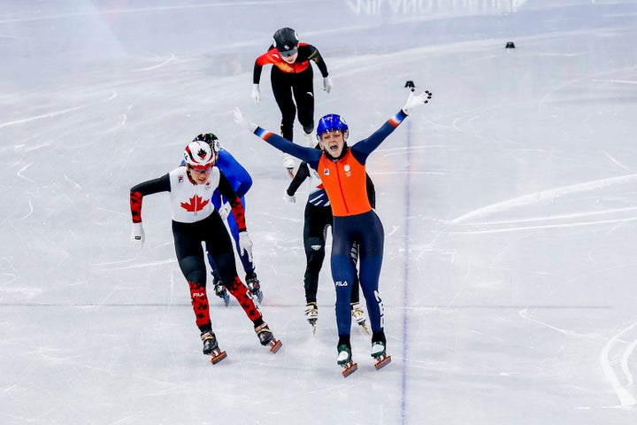 The Dutch Xandra Velzeboer celebrates after the 1,000 meter short track speed skating test.