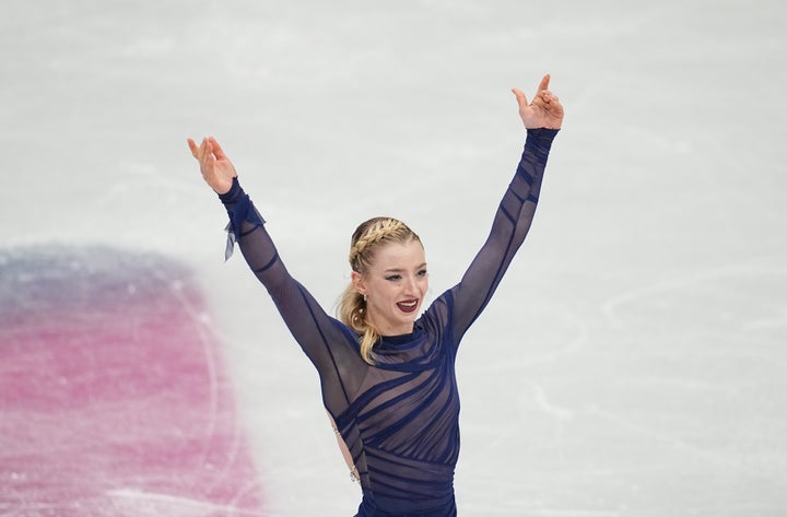 Amber Glenn, pictured after her free skate at the Milan Cortina Olympics, worked with a coach who's been arrested for indecency with a minor.
