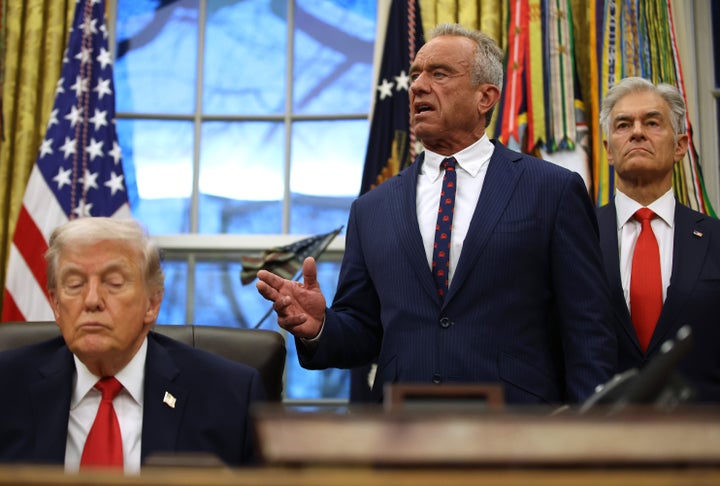 RFK and Trump, pictured above, both rock the distinctly MAGA tan — likely with a combination of self-tanning services or make up.