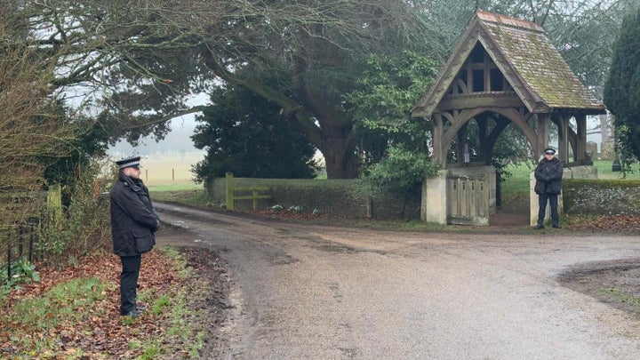 Police officers stand outside Andrew Mountbatten-Windsor's home, Wood Farm, in Norfolk, U.K. on Thursday.