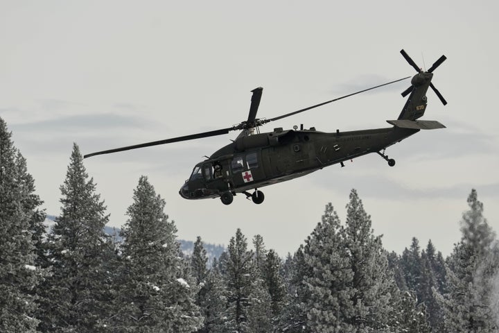 A U.S. Army Blackhawk helicopter takes off from the Truckee Tahoe Airport as recovery efforts for a group of missing skiers continue, continue in Truckee, Calif., Saturday, Feb. 21, 2026. (AP Photo/Godofredo A. Vásquez)