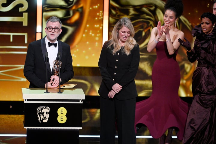 Paul Thomas Anderson and Sara Murphy accept the best film award for 'One Battle After Another' onstage at Sunday's BAFTA Film Awards in London.