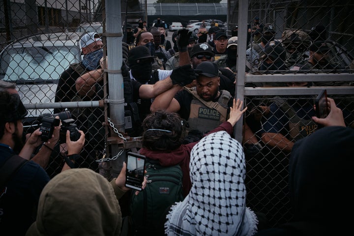 Protesters clash with federal agents outside Delaney Hall Detention Facility, where Abdellatif Hafraoui, 60, was detained last year.