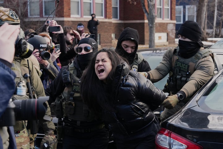 Masked federal agents arrest US citizen Aliya Rahman in Minneapolis on January 13, 2026.