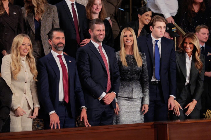 Barron Trump's blue tie clashed with the red worn by his older brothers, Donald Trump Jr. (second from left) and Eric Trump. It also seized the attention of tabloids.