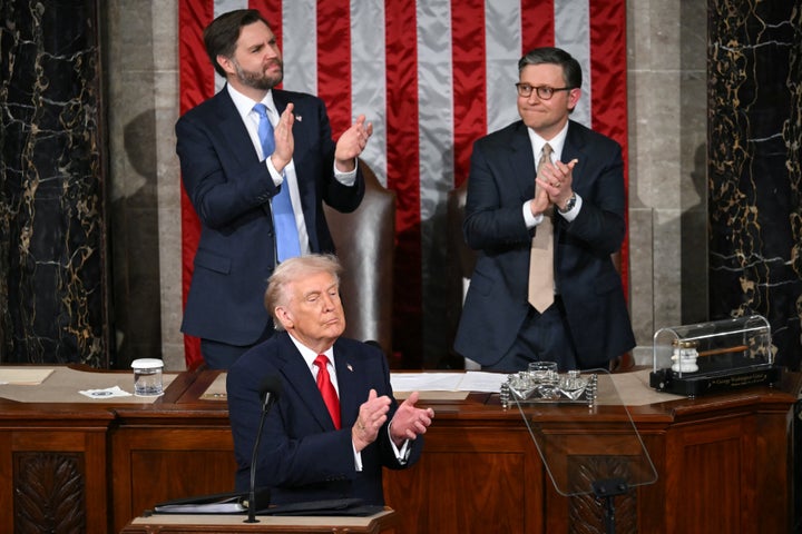 President Donald Trump applauds as U.S. veteran Captain E. Royce Williams receives the Medal of Honor during the State of the Union address.