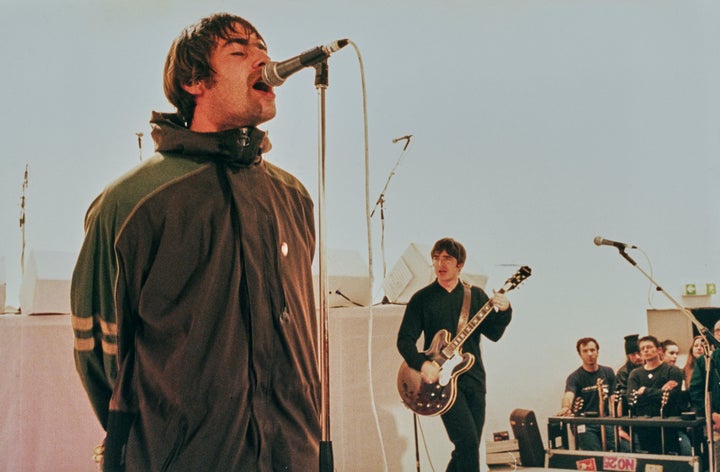 Singer Liam Gallagher (left) and his brother, Oasis guitarist Noel Gallagher, performed in London in 1995.