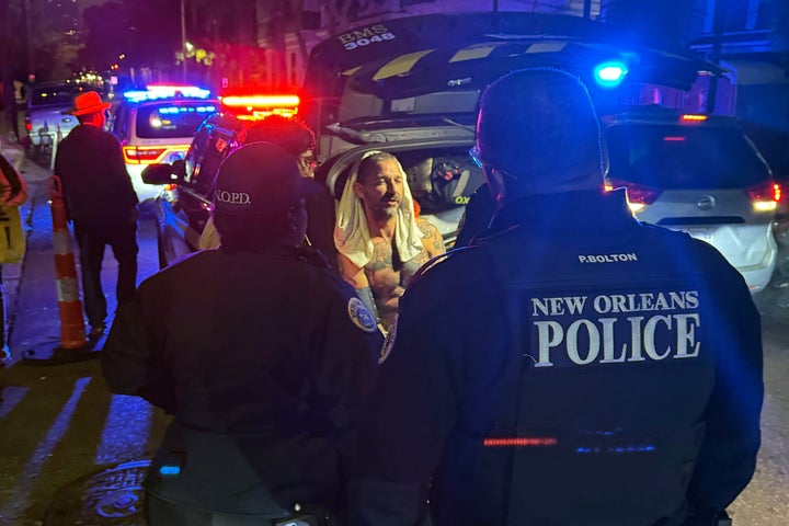 Shia LaBeouf, pictured here in police custody, was charged with two counts of assault after allegedly punching several people outside a New Orleans bar on February 17.