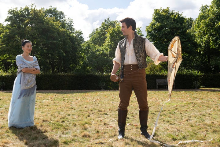 Sophie and Benedict flying a kite together early on in their Bridgerton love story