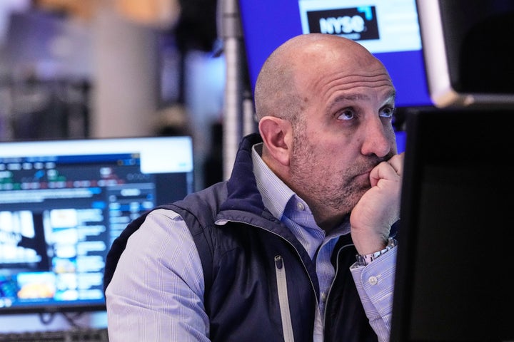 Specialist James Denaro works at his post on the floor of the New York Stock Exchange, Thursday, Feb. 19, 2026. (AP Photo/Richard Drew)