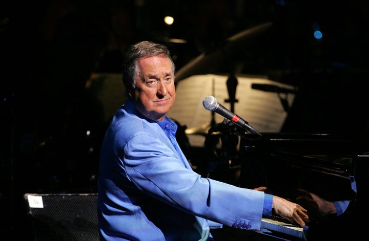 Neil Sedaka, the singer-songwriter behind dozens of hits from the '60s and 1 Singer Neil Sedaka performs with the Sydney Symphony Orchestra on stage at the Sydney Opera House on May 9, 2008 in Sydney, Australia. (Photo by Lisa Maree Williams/Getty Images)