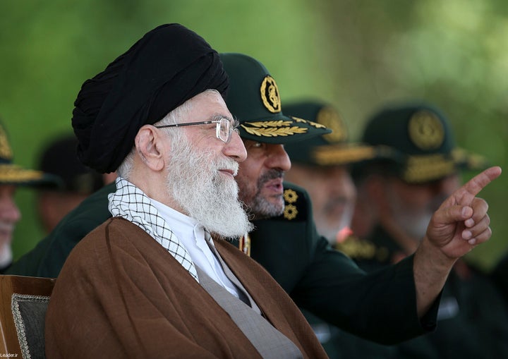 In this picture released by the official website of the office of the Iranian supreme leader, Supreme Leader Ayatollah Ali Khamenei listens to the then commander of the Revolutionary Guard Mohammad Ali Jafari during a graduation ceremony of a group of the guard's officers in Tehran, Iran, May 20, 2015. (Office of the Iranian Supreme Leader via AP, File)