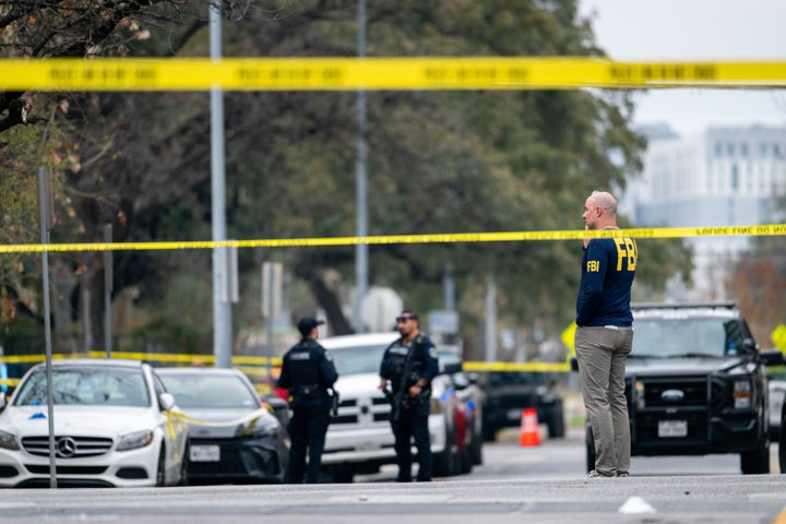AUSTIN, TEXAS - MARCH 01: Members of the FBI perform and local law enforcement investigate outside of Buford's bar in downtown on March 01, 2026 in Austin, Texas. Three people are dead and 14 others hospitalized following a mass shooting early Sunday morning. (Photo by Brandon Bell/Getty Images)