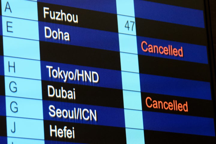 Canceled flights to Dubai and Doha are displayed on the flight information screen at Hong Kong International Airport on March 2, 2026, in Hong Kong.