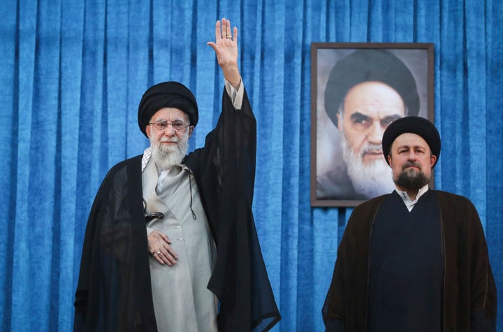 Ali Khamenei 1 In this photo released by the official website of the Iranian Supreme Leader's Office, Ali Khamenei waves to the crowd as he arrives at a ceremony marking the anniversary of the 1989 death of the late revolutionary founder Ayatollah Khomeini, as shown on the sign in the background, while Ayatollah Khomeini's grandson Hassan stands at right, at his shrine on the outskirts of Tehran, Iran, June 4, 2025.