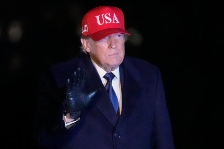 President Donald Trump waves after arriving on Marine One on the South Lawn of White House, Sunday, March 1, 2026, in Washington. (AP Photo/JMark Schiefelbein)