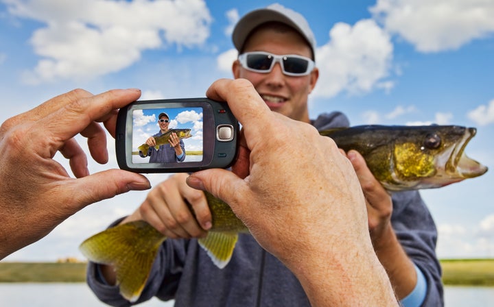 The “fish photo” gets a lot of flak — but if you earnestly love fishing (and can make conversation about it), a recent fishing photo is better than that college selfie or the dead-eyed gym picture.