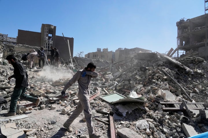 A group of men inspects the ruins of a police station struck Monday amid the U.S.–Israeli military campaign in Tehran, Iran, on March 3, 2026.