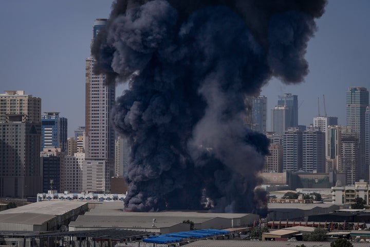 A black plume of smoke rises from a warehouse at the industrial area of Sharjah City in the United Arab Emirates following reports of Iranian strikes in Dubai, United Arab Emirates, on March 1, 2026.
