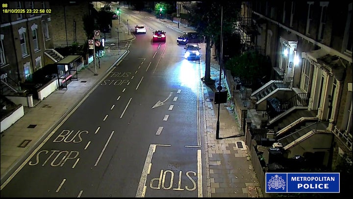 Screen grab taken from CCTV issued by the Metropolitan Police showing the BMW, top center, being driven along the center of the road, narrowly avoiding a collision, in London, before it later hit 20-year-old Yubin Tamang.