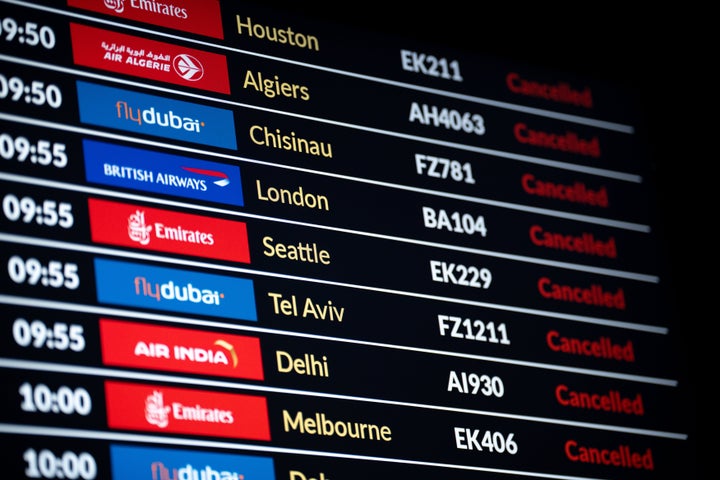 The arrivals and departures board of DXB Dubai International Airport is displayed on a computer screen in Krakow, Poland, on March 4, 2026. The table shows a list of canceled flights as global air travel faces chaos following military strikes by the United States and Israel against Iran. Airlines suspend thousands of flights due to the total closure of airspaces over Iran, Iraq, and Jordan, and restricted zones across the UAE.